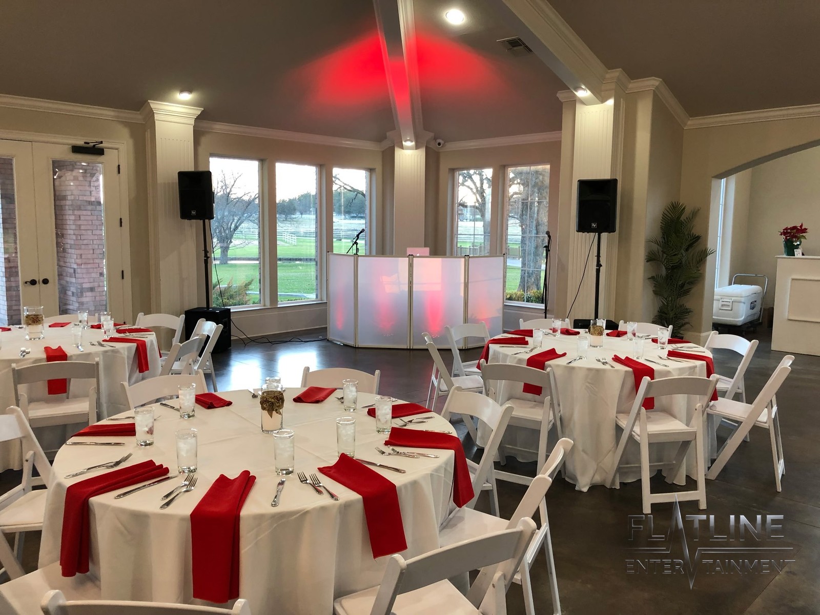 A decorated event room with the Flatline DJ booth set up and ready