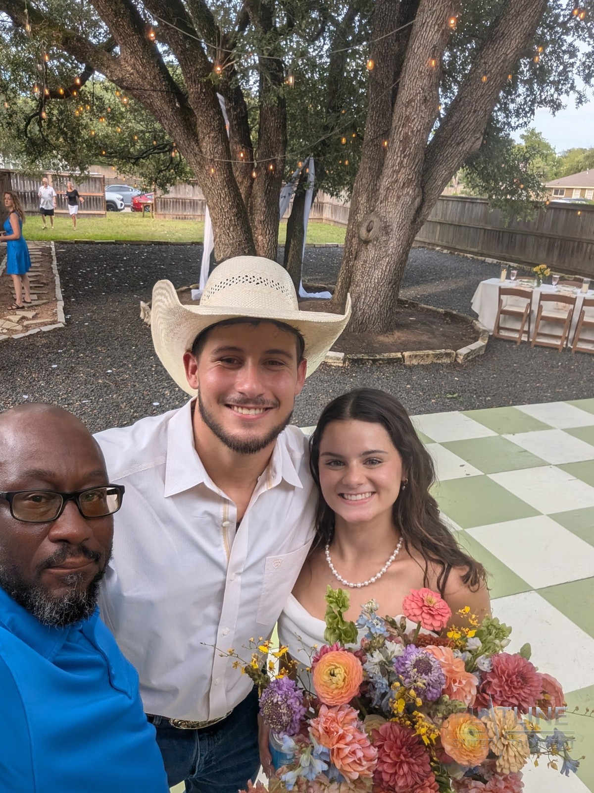 Mark Anthony taking an outdoor wedding selfie with the Guerra bride and groom