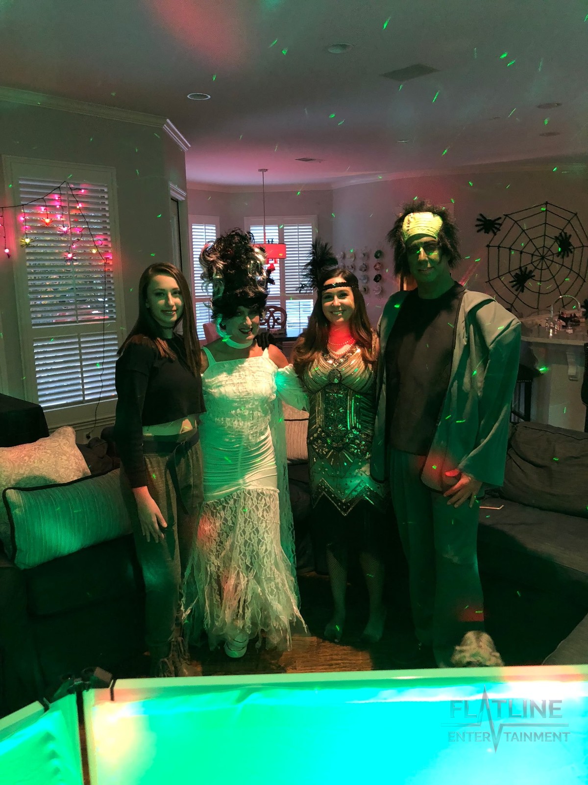Guests in costume dancing at a Halloween party