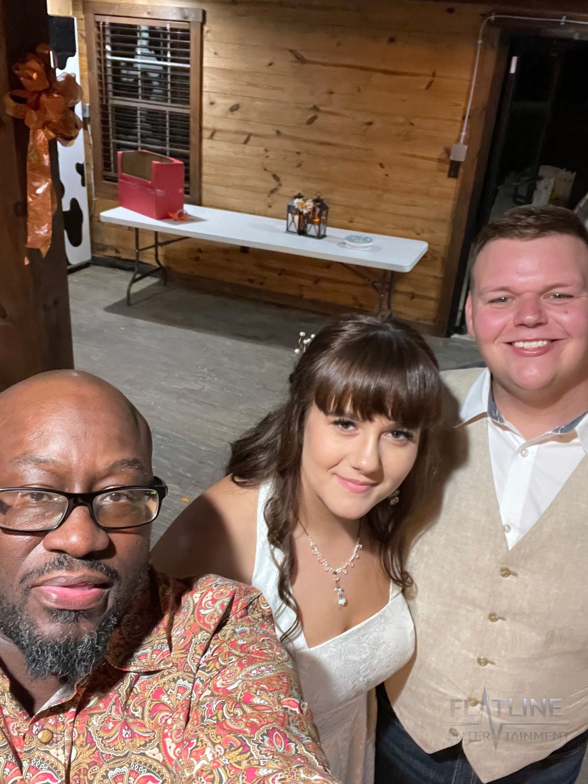 Mark Anthony taking a selfie with wedding clients Heath and Lanie Oakley